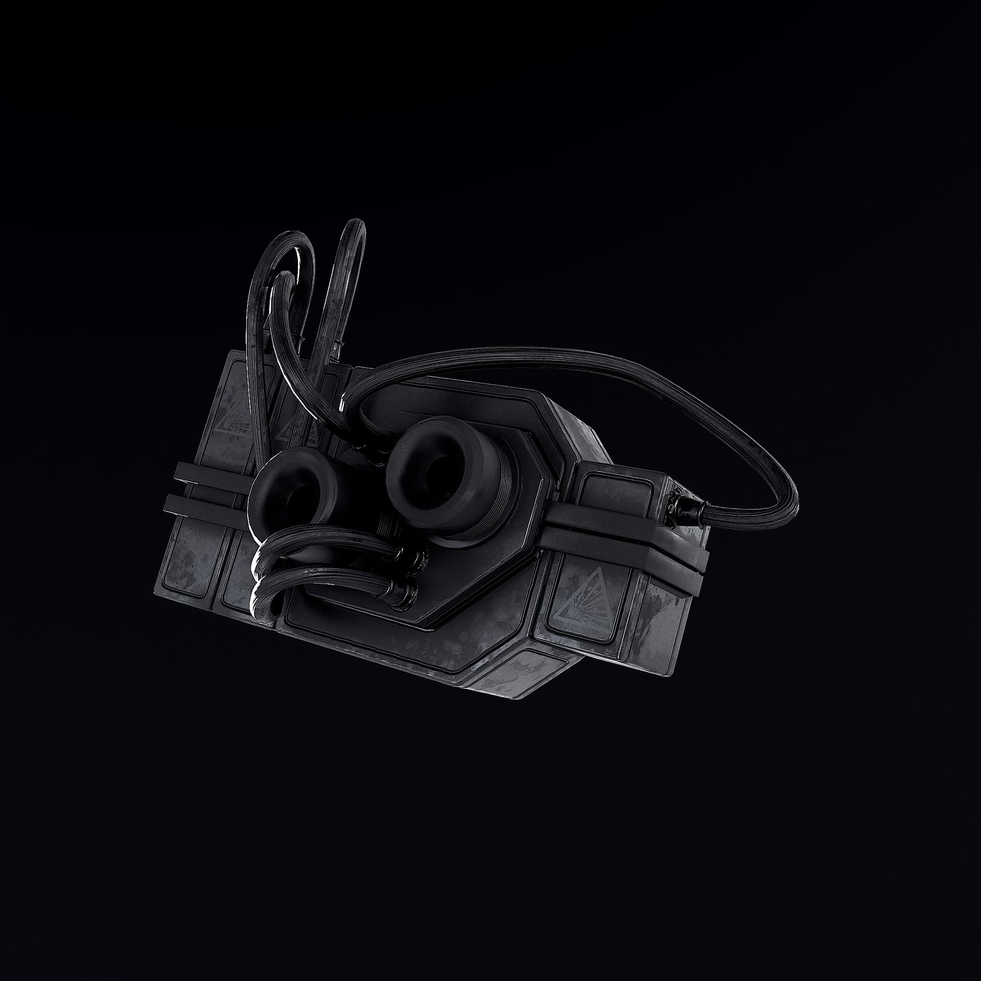A dark fictional explosive device with looping cables and circular fittings.